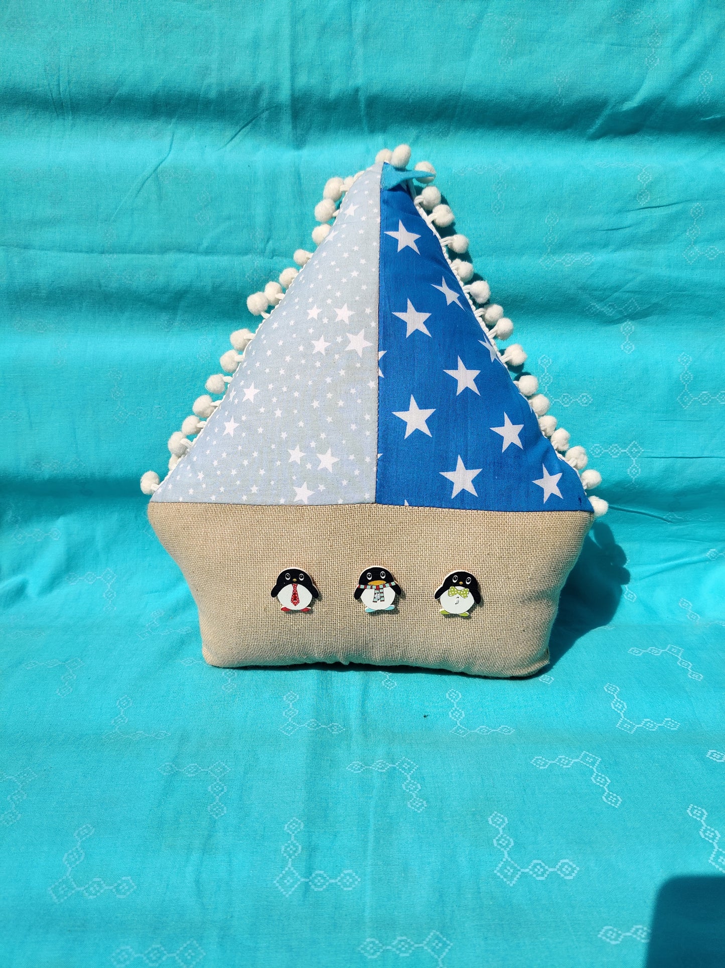 Starry Sailboat Cushion with Wooden Penguin Buttons