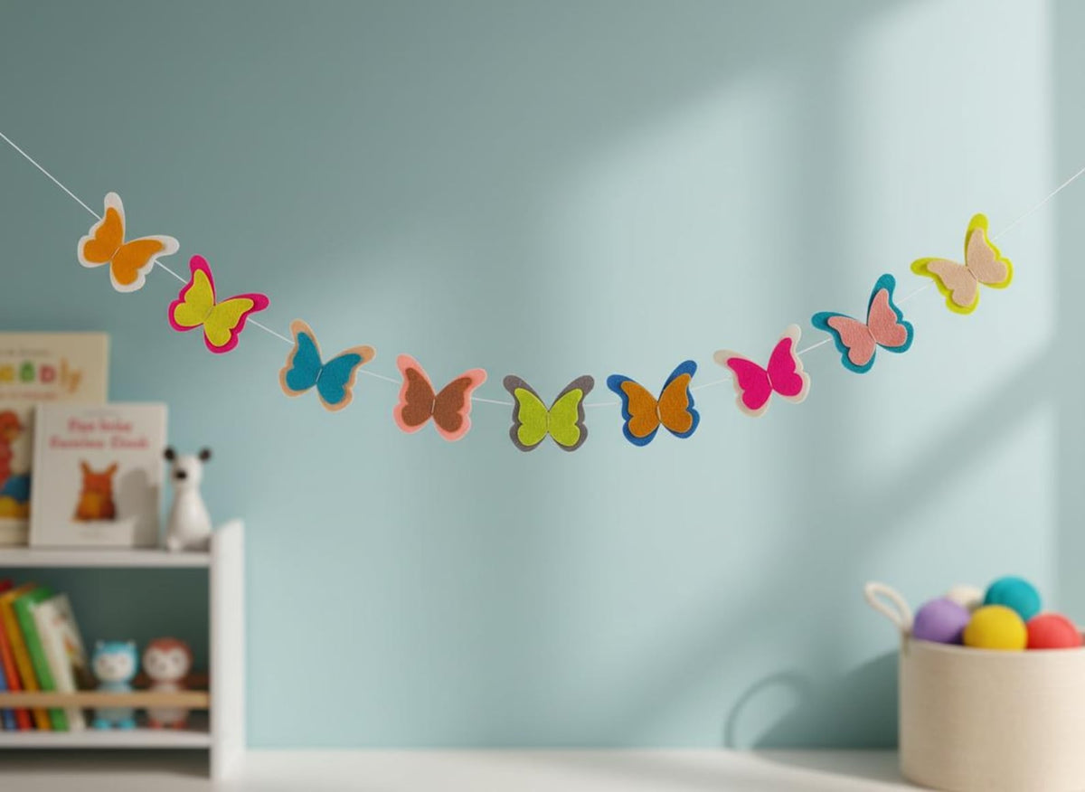 Multicoloured handmade butterfly garland against a light blue backdrop